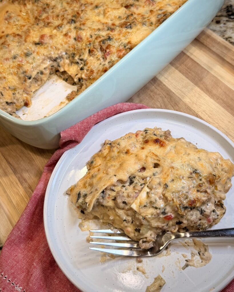 White Spinach Lasagna - Creamy, hearty, and packed with flavor, this white lasagna is made simple with oven-ready noodles and a rich sausage filling. Perfect for feeding a crowd or stocking the freezer.