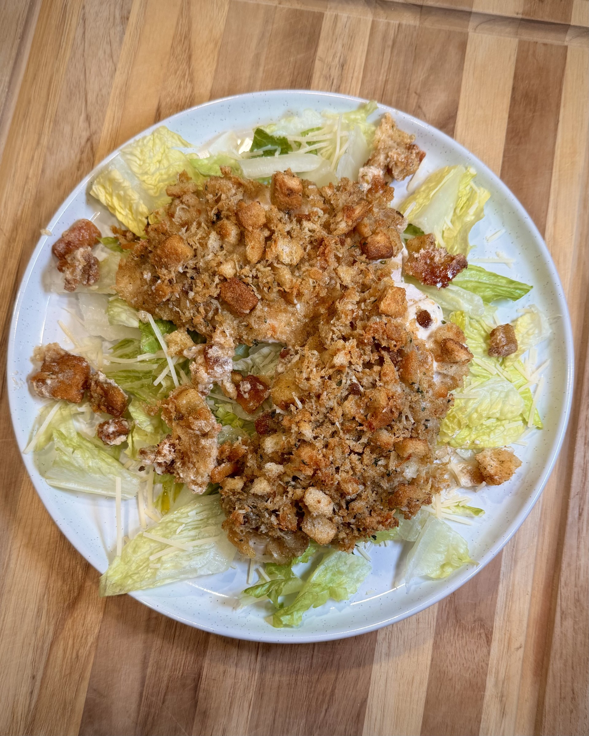 Baked Chicken Caesar - This easy baked chicken takes everything you love about a Caesar salad and turns it into a comforting, oven-baked dinner. Crunchy, cheesy, buttery goodness with minimal prep.