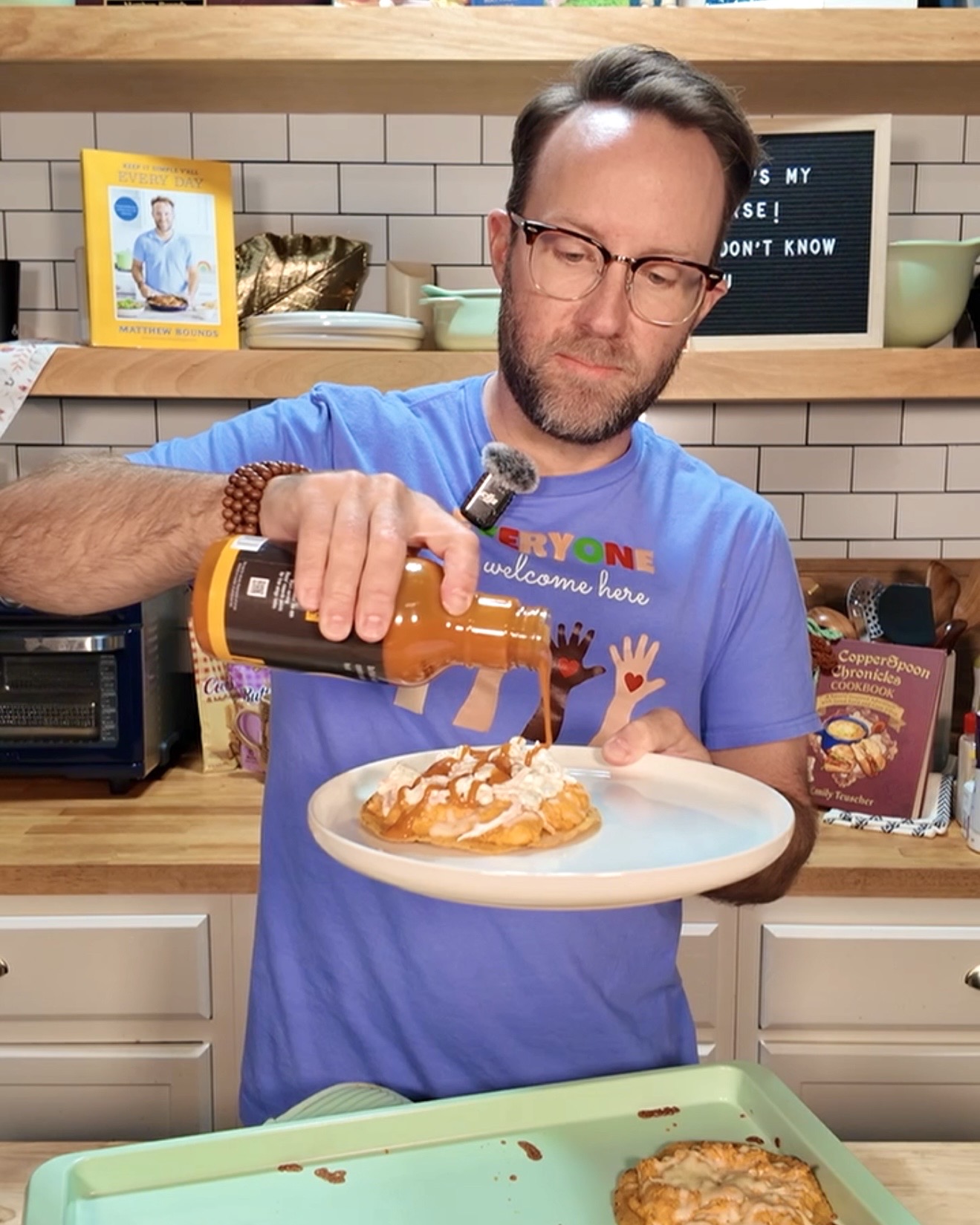 Matthew holding buffalo chicken tostadas