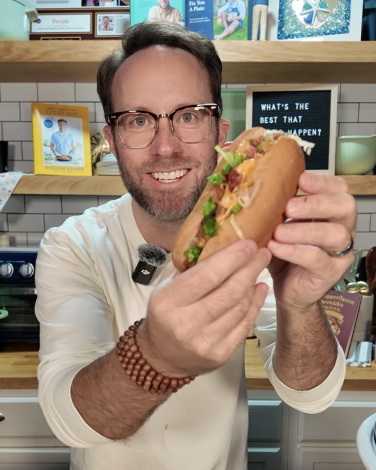 Matthew holding buffalo ranch chicken sandwich