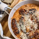 Cajun’t chicken gnocchi in a skillet on a table