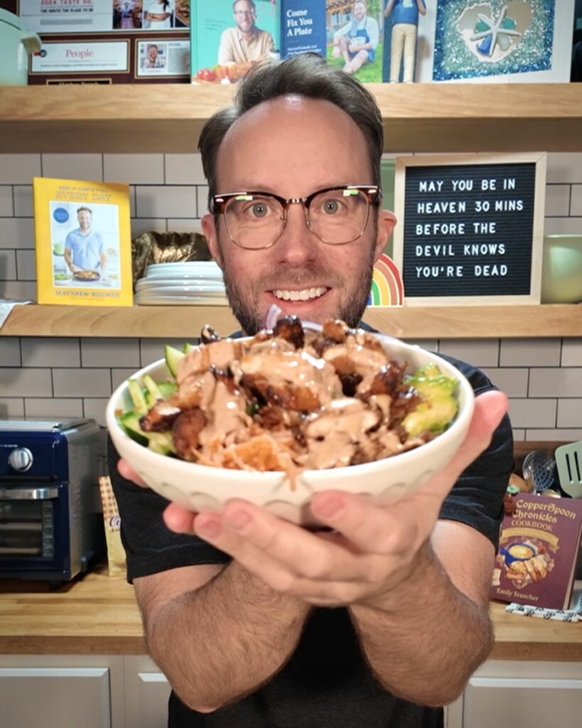Matthew holding Crispy Rice Bang Bang Bowl