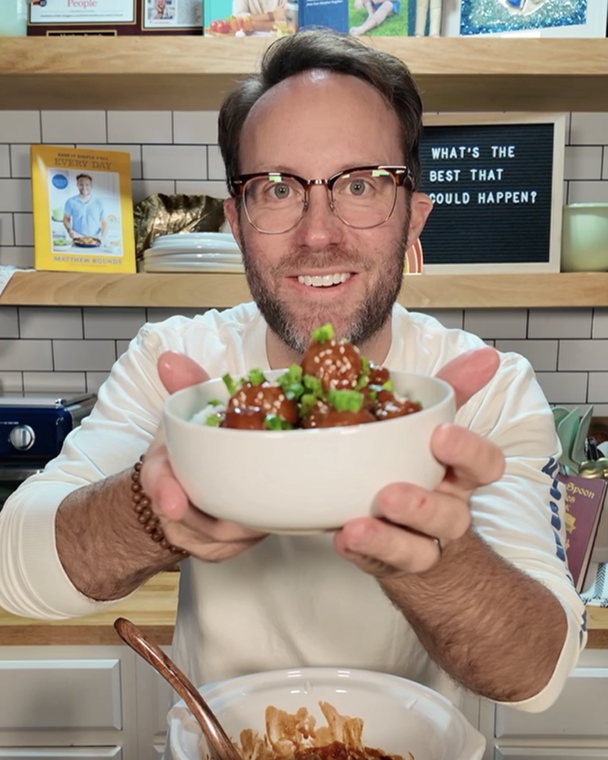 Matthew holding honey garlic crockpot meatballs in bowl