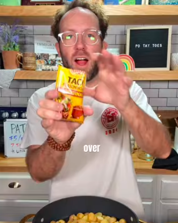 Matthew holding taco seasoning