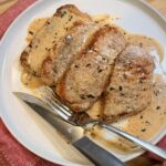 Creamy Tarragon Mustard Pork Chops on a plate