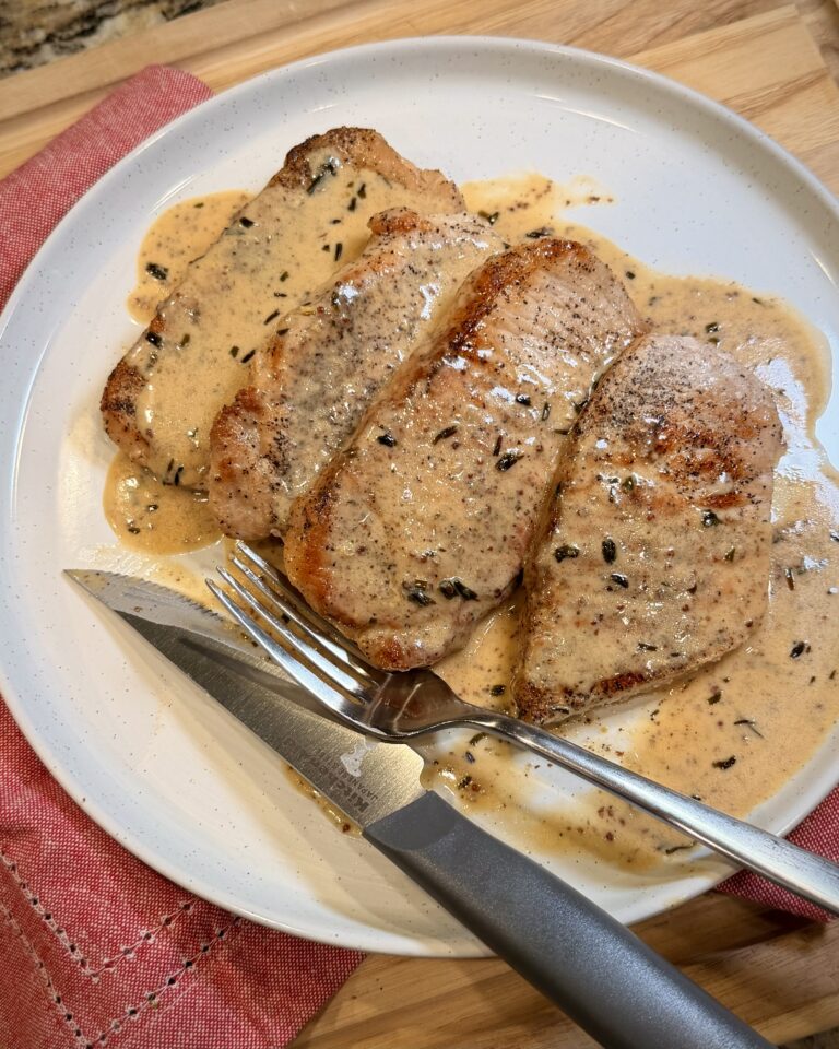 Creamy Tarragon Mustard Pork Chops on a plate