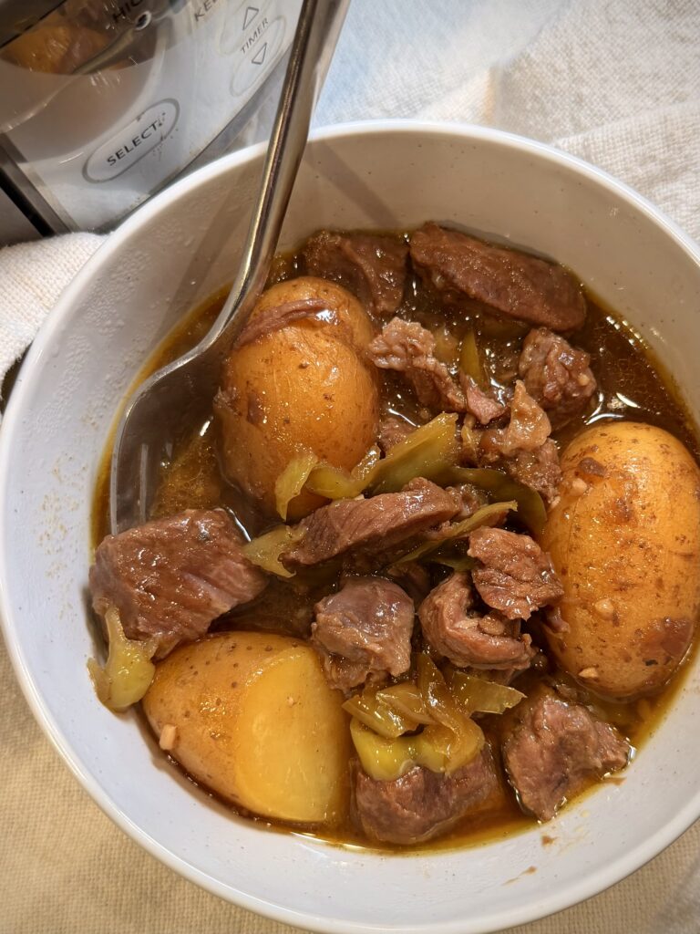 Crockpot Italian Beef and Gravy in a bowl on a table