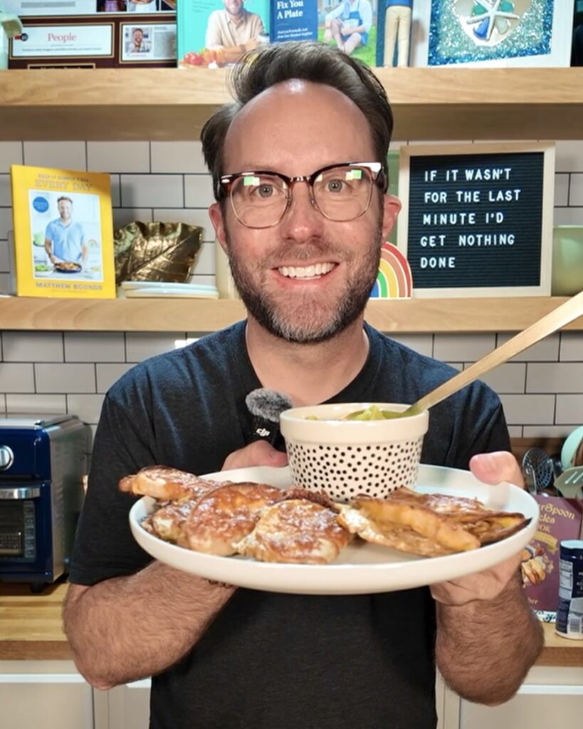 Your Barefoot Neighbor Matthew Bounds holds a plate of Crockpot Pork Street Tacos in his kitchen