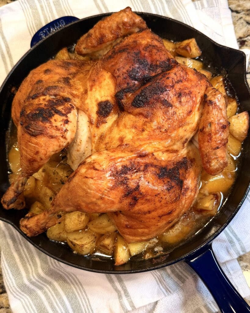 Spatchcock Chicken in cast iron skillet on counter from Keep It Simple Y'all Every Day Cookbook by Matthew Bounds