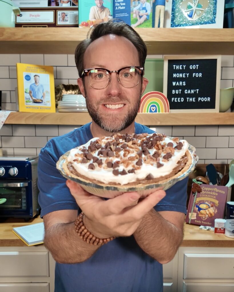 Matthew Bounds, creator of Your Barefoot Neighbor, holds his Mississippi Mud Pie from Keep It Simple Y'all Every Day in his kitchen.