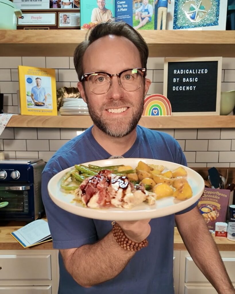Your Barefoot Neighbor Matthew Bounds holds Sheet Pan Caprese Chicken from Keep It Simple Y'all Every Day on a plate with green beans and potatoes.