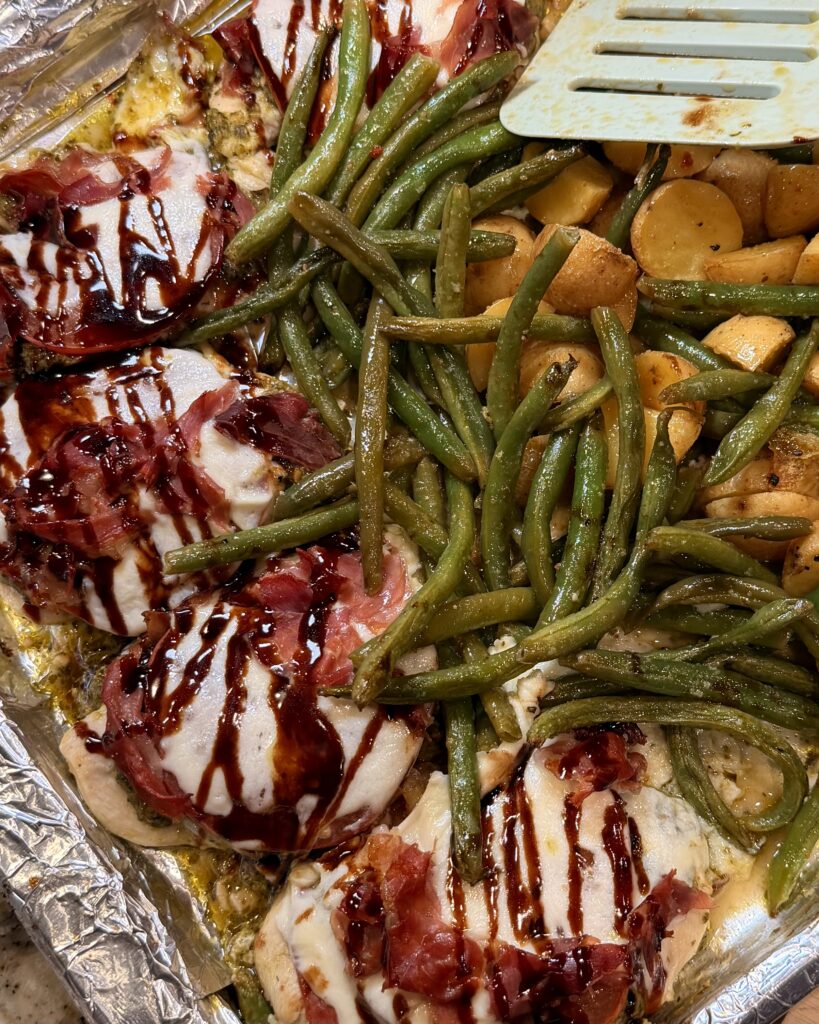 Sheet Pan Caprese Chicken from Matthew Bounds, Creator of Your Barefoot Neighbor's New Book Keep it Simple Y'all Every Day. The ingredients for the meal are all on one pan.