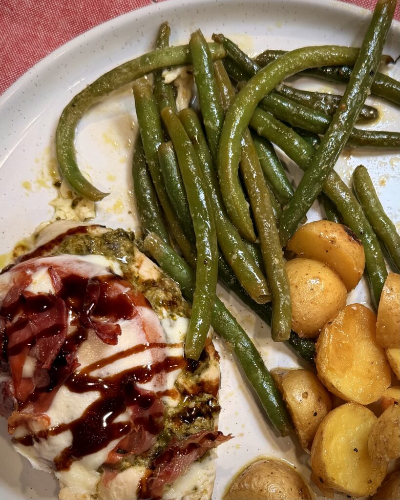 Sheet Pan Caprese Chicken from Keep It Simple Y'all Every Day on a plate with green beans and potatoes.