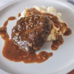 Your Barefoot Neighbor's Salisbury Steak and Gravy with Mashed Potatoes on a plate