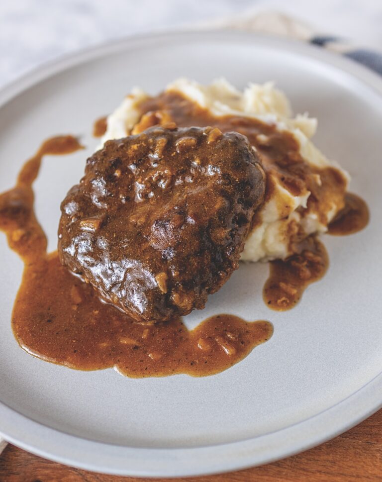 Your Barefoot Neighbor's Salisbury Steak and Gravy with Mashed Potatoes on a plate