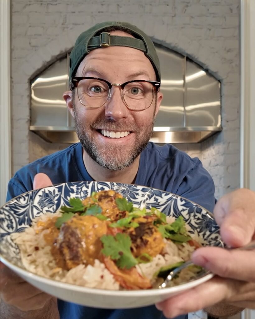 Matthew Bounds, Your Barefoot Neighbor and Keep It Simple Y'all Every Day author, holds a bowl of Coconut Curry Chicken Meatballs