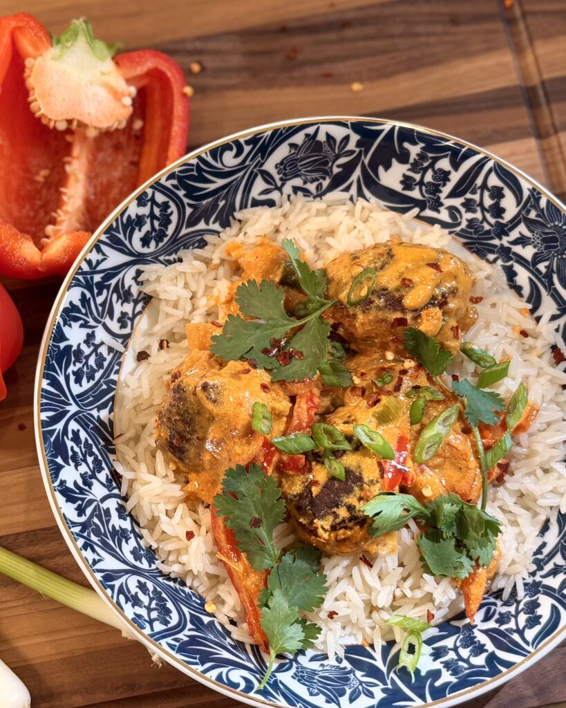 Coconut Curry Chicken Meatballs from Keep It Simple Y'all Every Day in a bowl garnished with cilantro