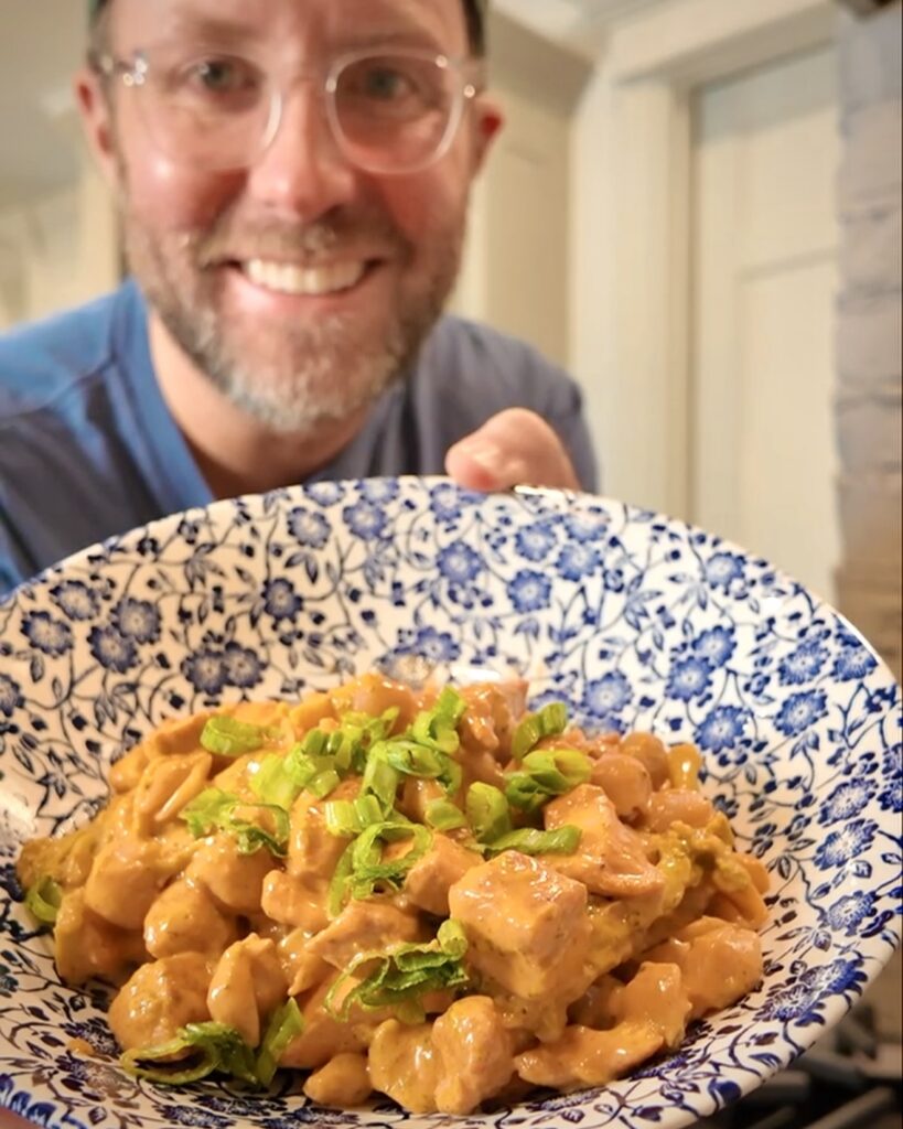 Matthew Bounds, creator of Your Barefoot Neighbor, holds Buffalo Chicken Broccoli Mac N Cheese