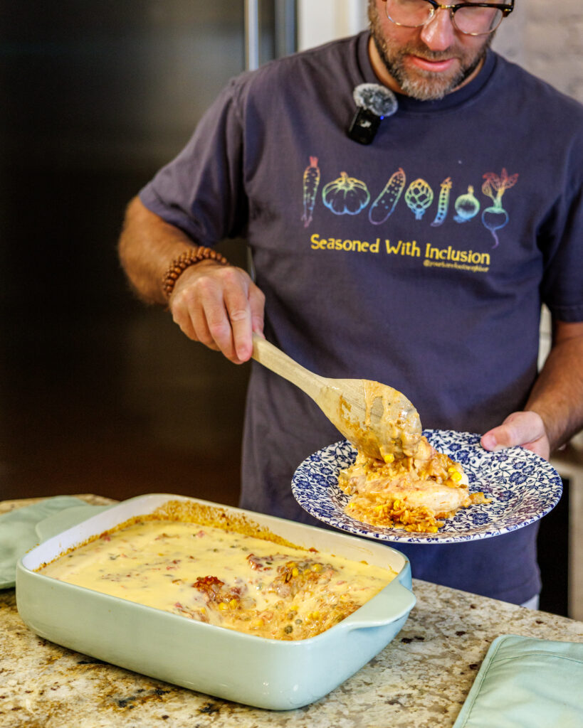 Your Barefoot Neighbor Matthew Bounds scoops out some of his Baked Swim Queso Chicken onto a plate