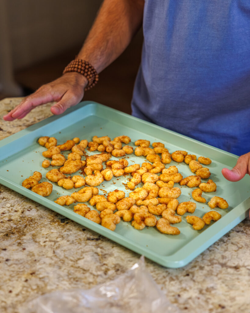 Matthew Bounds, creator of Your Barefoot Neighbor, prepares the shrimp for his Bang Bang Shrimp Tacos