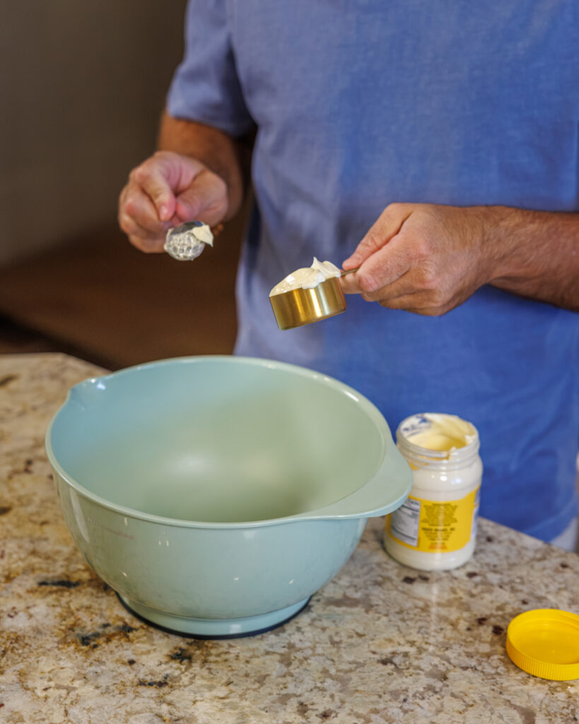 Matthew Bounds, creator of Your Barefoot Neighbor, prepares ingredients for his Bang Bang Shrimp Tacos 