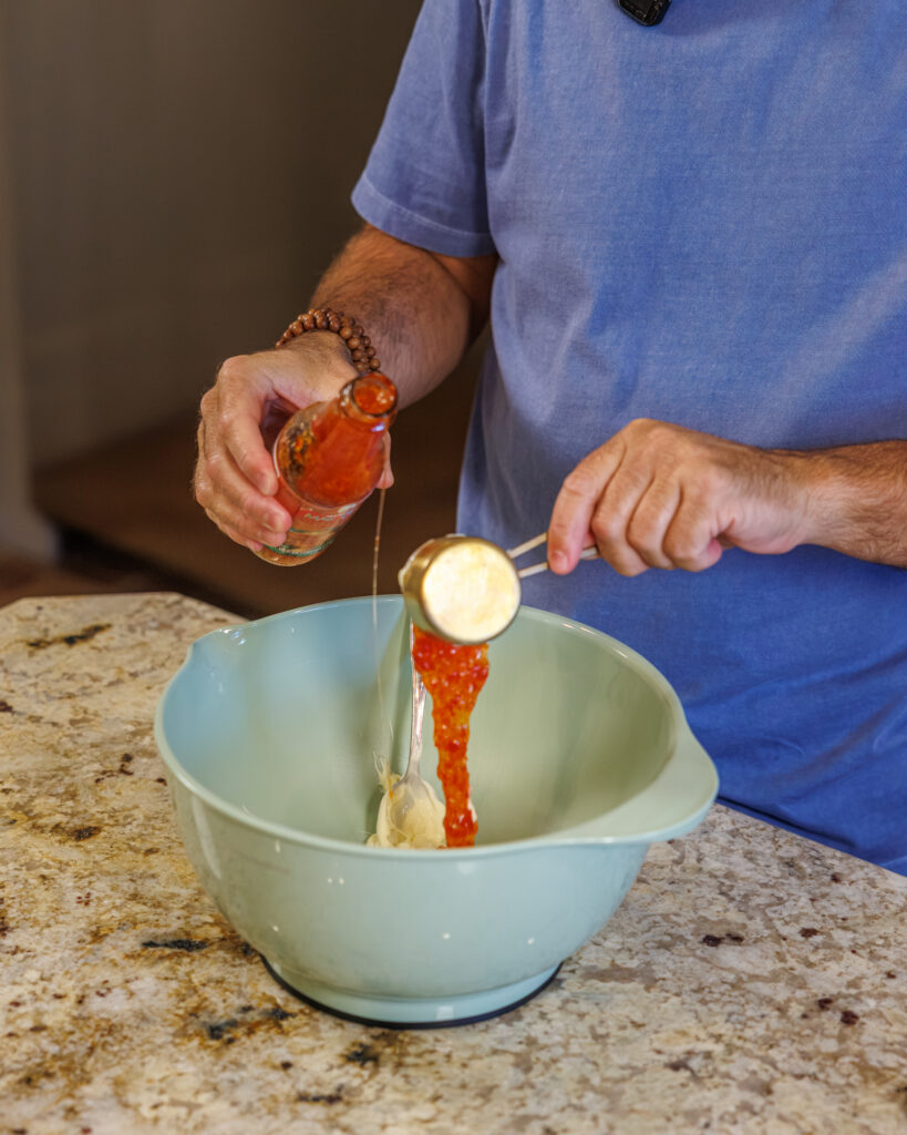 Matthew Bounds, creator of Your Barefoot Neighbor, prepares ingredients for his Bang Bang Shrimp Tacos 