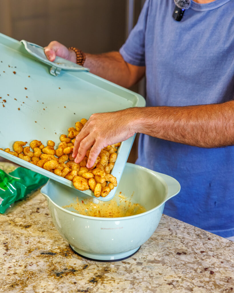 Matthew Bounds, creator of Your Barefoot Neighbor, prepares ingredients for his Bang Bang Shrimp Tacos 