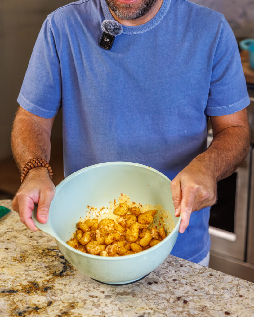 Matthew Bounds, creator of Your Barefoot Neighbor, prepares ingredients for his Bang Bang Shrimp Tacos 