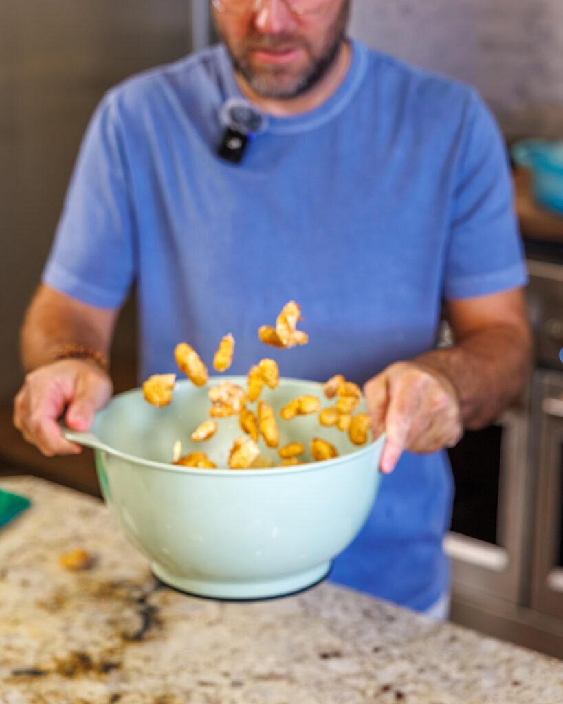 Matthew Bounds, creator of Your Barefoot Neighbor, prepares ingredients for his Bang Bang Shrimp Tacos 