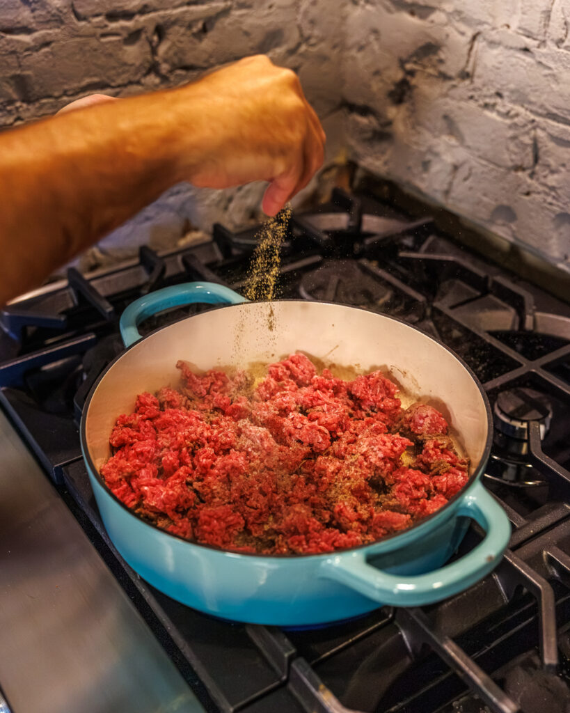 Matthew Bounds, creator of Your Barefoot Neighbor, prepares the beef for his Cheddar Biscuit Beef Pie from Keep It Simple Y'all Every Day