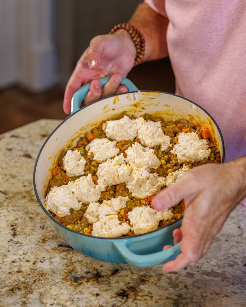 Matthew Bounds, creator of Your Barefoot Neighbor, prepares ingredients to his Cheddar Biscuit Beef Pie from Keep It Simple Y'all Every Day