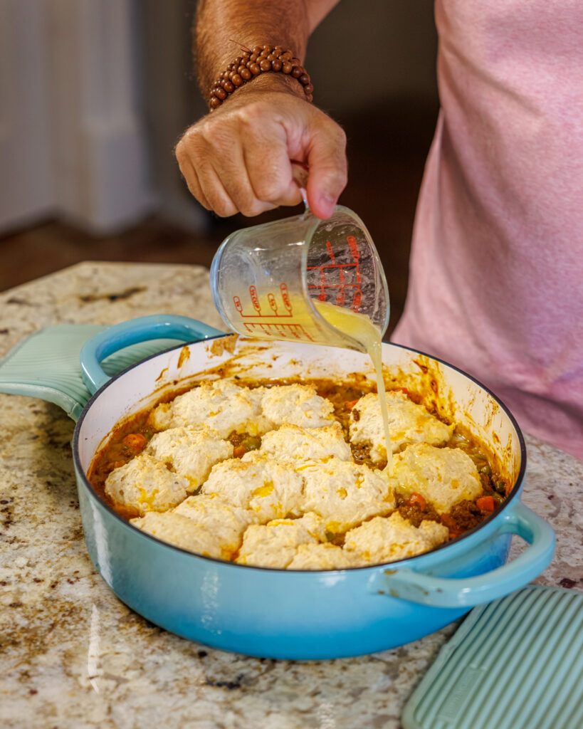 Matthew Bounds, creator of Your Barefoot Neighbor, prepares ingredients to his Cheddar Biscuit Beef Pie from Keep It Simple Y'all Every Day