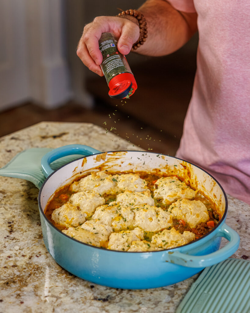 Matthew Bounds, creator of Your Barefoot Neighbor, prepares ingredients to his Cheddar Biscuit Beef Pie from Keep It Simple Y'all Every Day