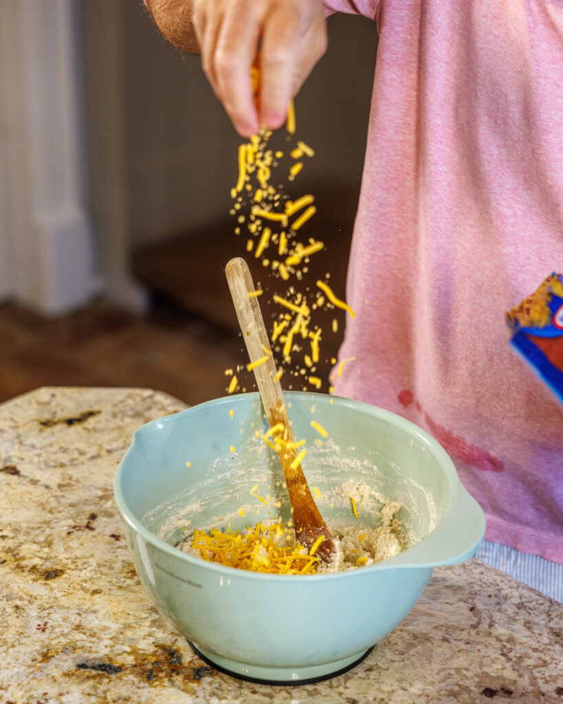 Matthew Bounds, creator of Your Barefoot Neighbor, prepares ingredients to his Cheddar Biscuit Beef Pie from Keep It Simple Y'all Every Day