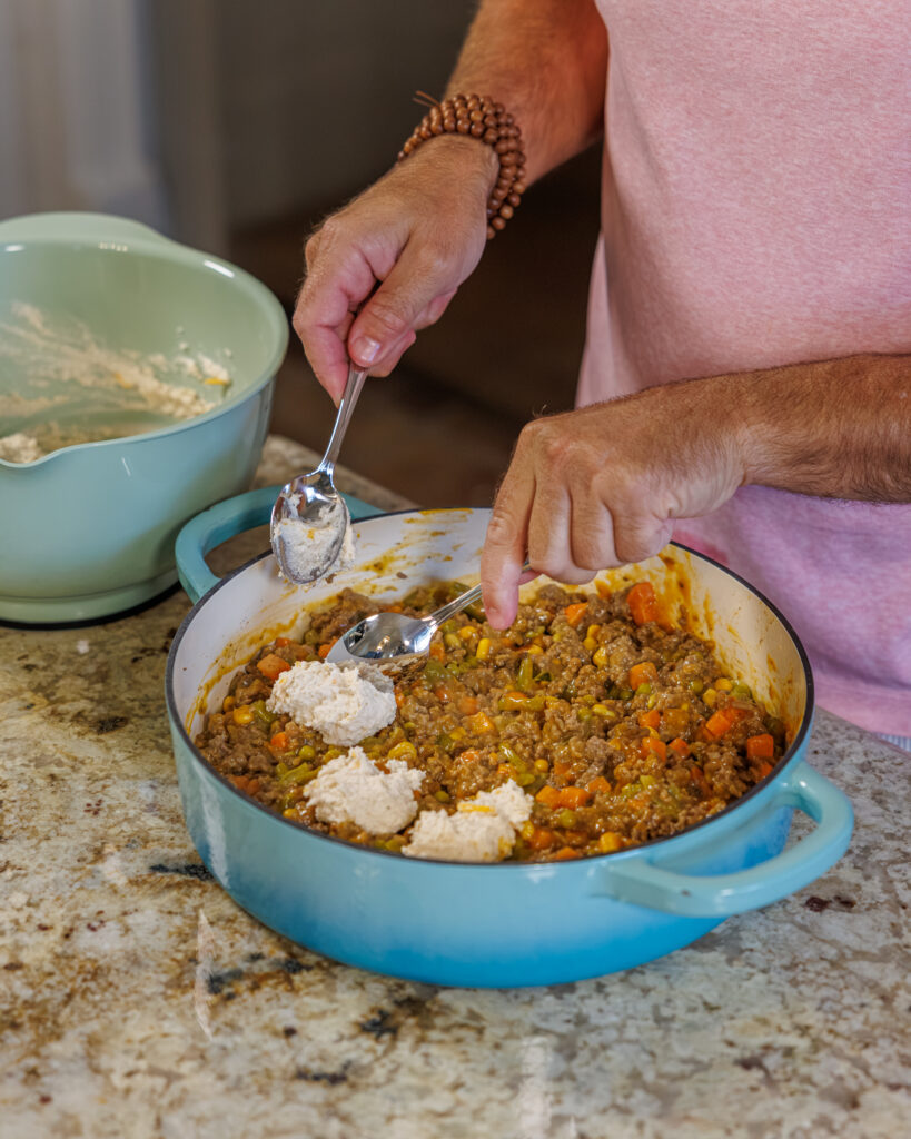 Matthew Bounds, creator of Your Barefoot Neighbor, prepares ingredients to his Cheddar Biscuit Beef Pie from Keep It Simple Y'all Every Day