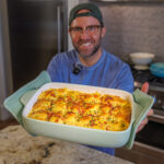 Matthew Bounds, creator of Your Barefoot Neighbor, holds a pan of Chicken Bacon Ranch Rolls fresh out of the oven