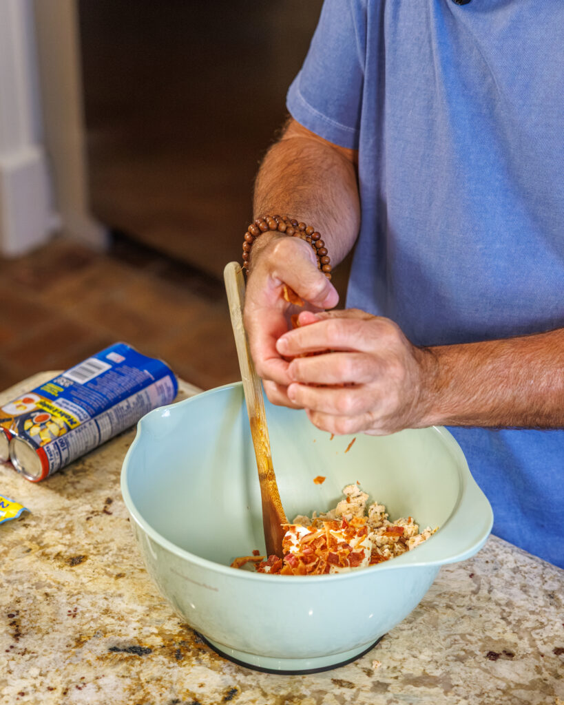 Matthew Bounds, creator of Your Barefoot Neighbor, prepares ingredients for his Chicken Bacon Ranch Rolls