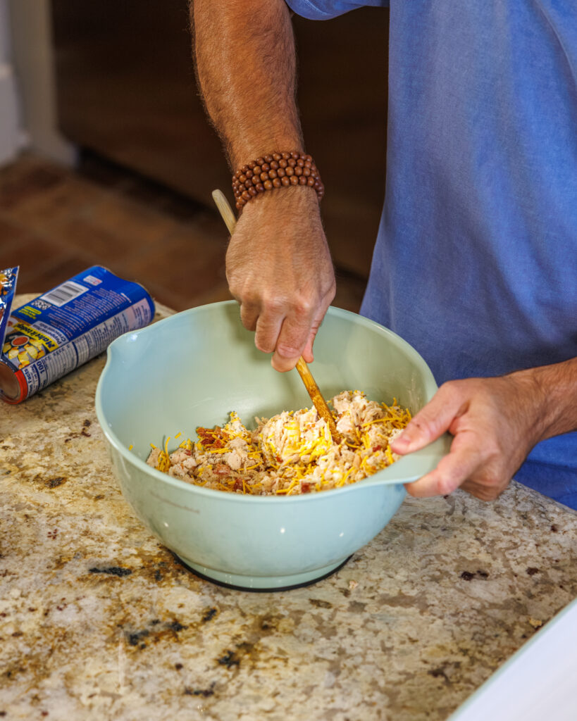 Matthew Bounds, creator of Your Barefoot Neighbor, prepares ingredients for his Chicken Bacon Ranch Rolls