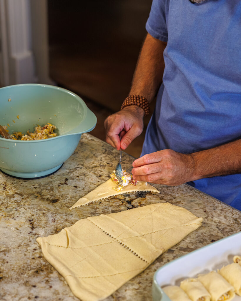 Matthew Bounds, creator of Your Barefoot Neighbor, prepares ingredients for his Chicken Bacon Ranch Rolls