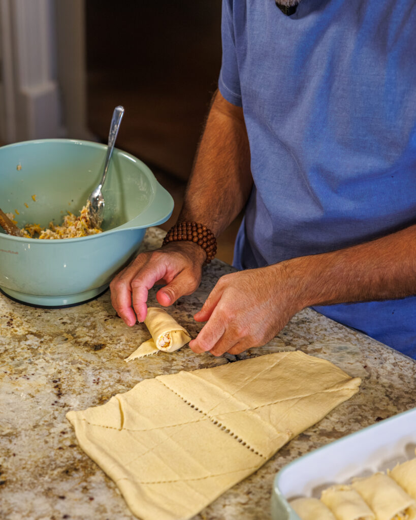 Matthew Bounds, creator of Your Barefoot Neighbor, prepares ingredients for his Chicken Bacon Ranch Rolls