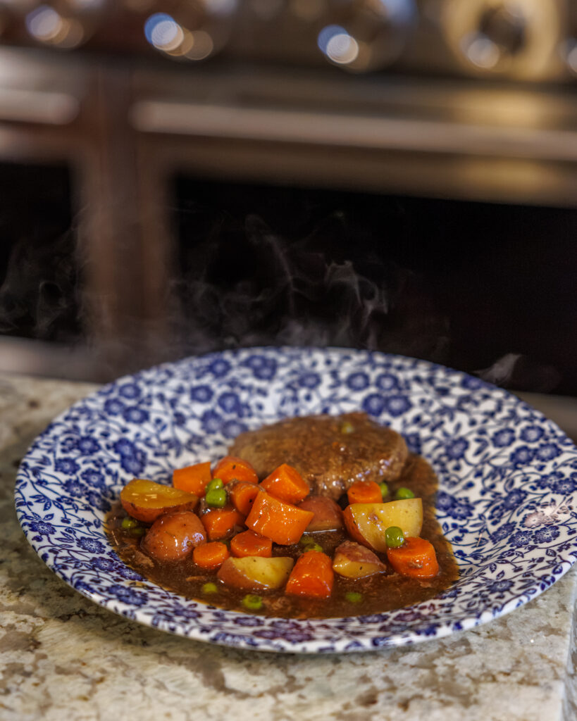 Hamburger Steaks and Gravy by Your Barefoot Neighbor Matthew Bounds on a plate