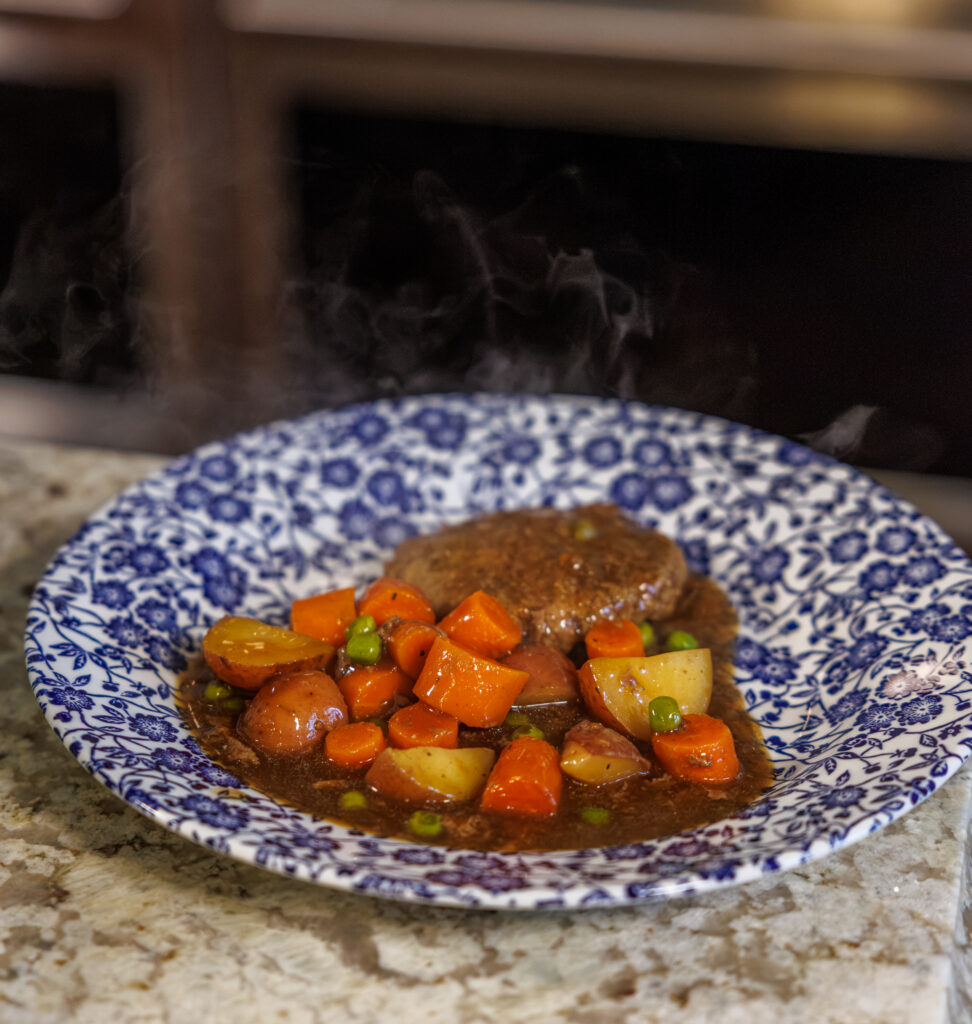 Hamburger Steaks and Gravy by Your Barefoot Neighbor Matthew Bounds on a plate