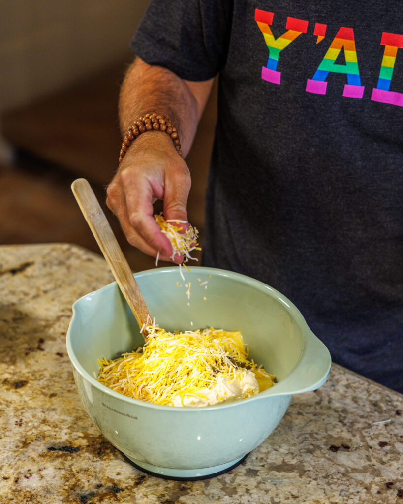 Matthew Bounds, creator of Your Barefoot Neighbor, prepares items for his Jalapeno Popper Chicken Casserole dish in his kitchen