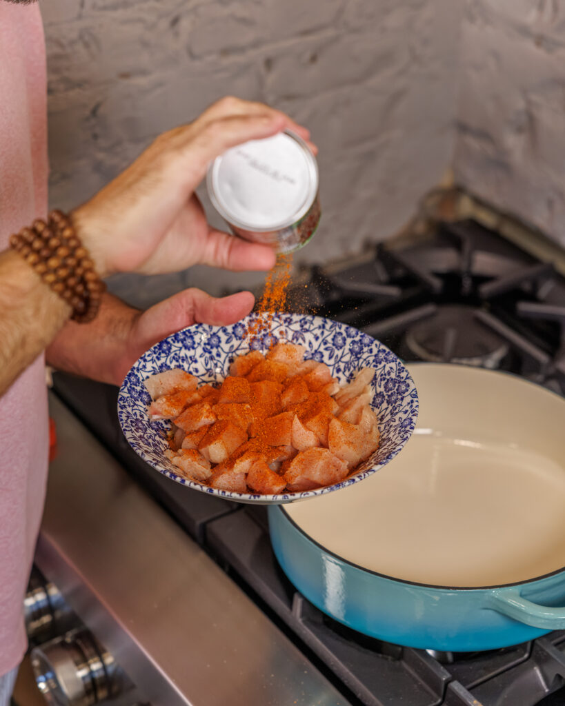 Matthew Bounds, creator of Your Barefoot Neighbor, prepares the chicken for his One Pot Corn & Pimento Orzo