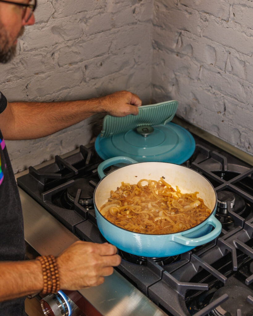 Matthew Bounds, creator of Your Barefoot Neighbor, prepares ingredients to his One Pot French Onion Pasta 
