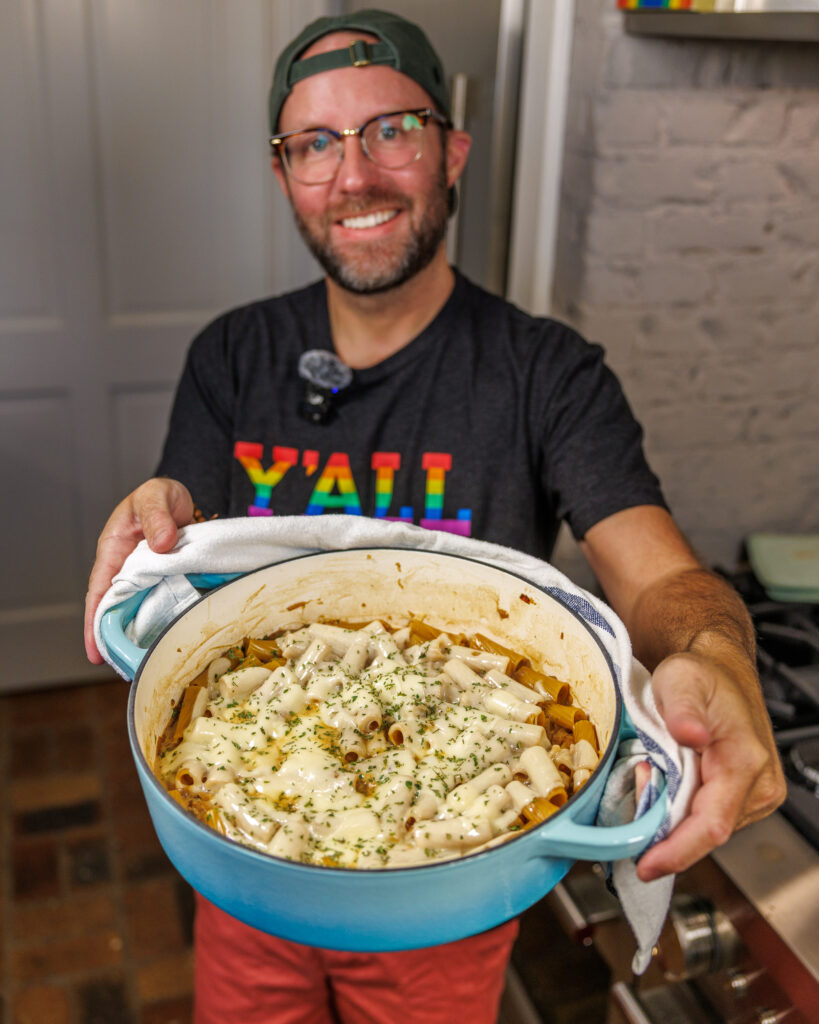 Matthew Bounds, creator of Your Barefoot Neighbor, holds a pot of his One Pot French Onion Pasta