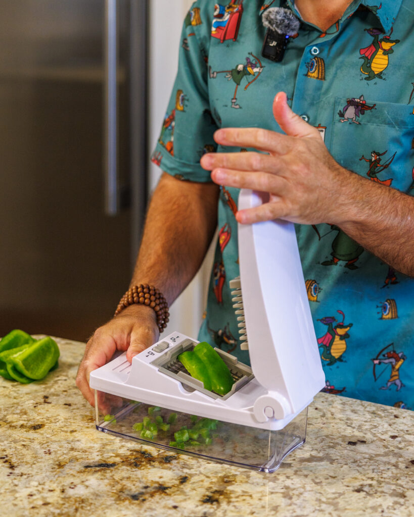 Matthew Bounds, creator of Your Barefoot Neighbor, chops vegetables for his Pizza Bubble Bake dish