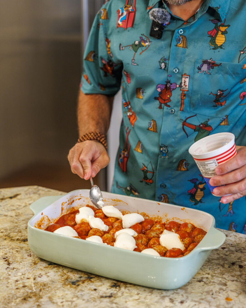 Matthew Bounds, creator of Your Barefoot Neighbor, adds cheese to his Pizza Bubble Bake dish