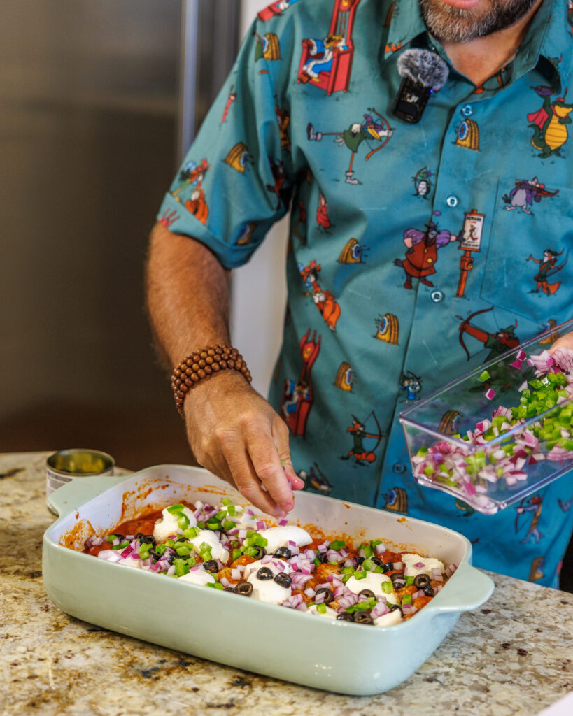 Matthew Bounds, creator of Your Barefoot Neighbor, adds ingredients to his Pizza Bubble Bake dish