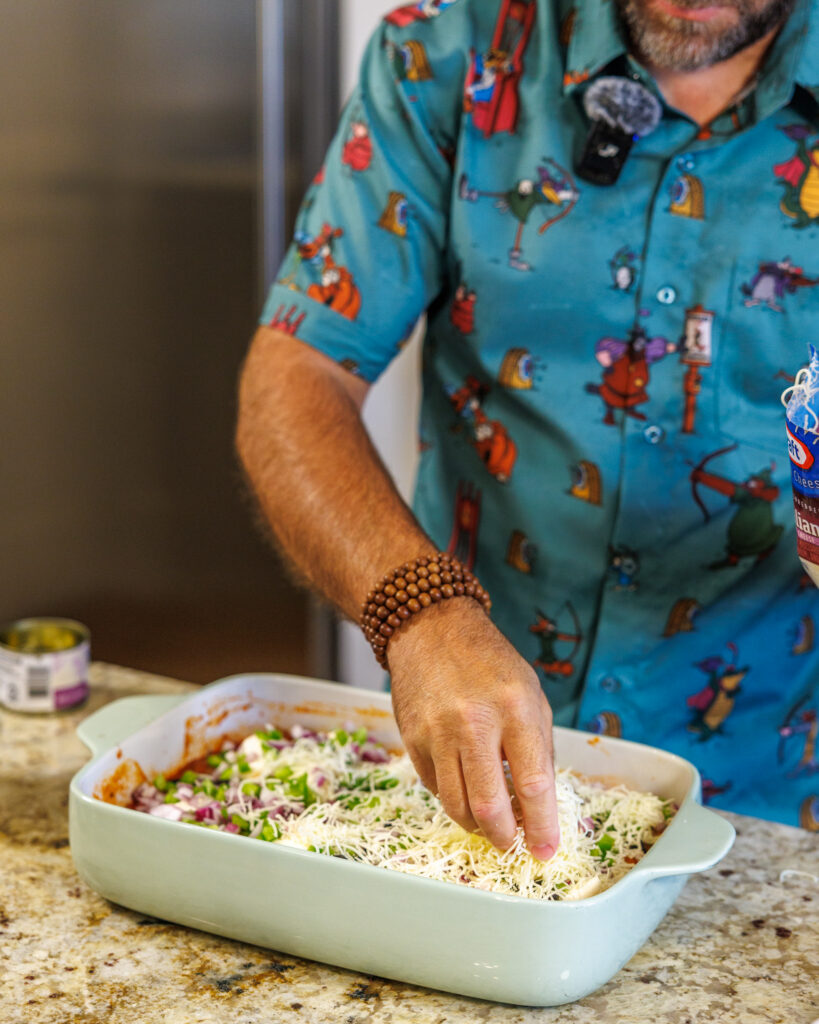Matthew Bounds, creator of Your Barefoot Neighbor, adds ingredients to his Pizza Bubble Bake dish